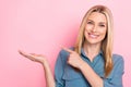 Closeup photo of young positive business lady wear blue formal blouse hold palm finger pointing empty space profit Royalty Free Stock Photo