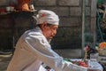 Closeup photograph of a Balinese Hindu high priest conducting a Ngaben ceremony in Ubud, Denpasar, Bali, Indonesia