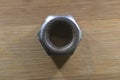 A Closeup photograph of an Industrial nut made of mild steel.