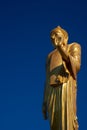 Closeup Phu khok ngio standing golden big buddha with blue sky background Royalty Free Stock Photo