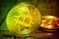 Closeup of physical bitcoin over computer cpu processors aligned. Royalty Free Stock Photo