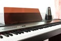 Closeup piano keyboard with metronome background. Royalty Free Stock Photo