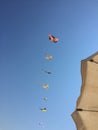 A closeup pic of a group of a colored group of flying kites Royalty Free Stock Photo