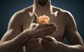 Closeup picture of athlete holding a flower Royalty Free Stock Photo