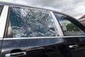 Closeup picture of black stolen damage car broken glass windows