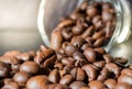 Closeup picture, Coffee beans with glass bottle and sunlight