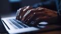 The closeup picture of hand of person holding and typing the keyboard. AIGX01.