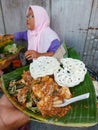 Closeup picture of lotek Indonesian street food , fresh vegetables with peanut sauce .