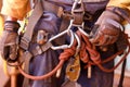 Rope access worker wearing full safety harness inspecting clocking Karabiner on a chair prior to abseiling