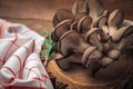 Closeup picture of oyster mushrooms on top of antique wooden board