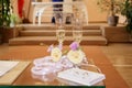 Closeup picture of shiny wedding glasses and a box of wedding rings Royalty Free Stock Photo