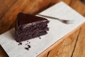 Delicious piece of chocolate cake sitting on a cafe table Royalty Free Stock Photo