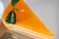 Closeup Piece of Orange cake on wooden table. selective focus