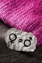 Symbols for gender equality, on a pink hat