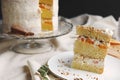 Closeup of a piece of white delicious Christmas cake with nuts and mandarine Royalty Free Stock Photo