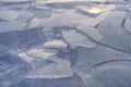 Closeup pieces cracked ice over body of water or river frozen in cold weather after winter frosts