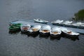 Closeup of a pier with many parked boats