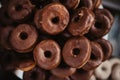 Closeup of a pile of chocolate donuts. Top view.