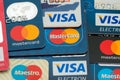 Closeup pile of credit cards, Visa and MasterCard, credit, debit and electronic