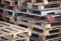 Closeup of pile of empty wooden pallets