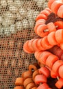 Closeup of a pile of fishing nets with a white rope and red and white cork floats in a fishing port