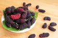 Pile of Fresh Ripe Mulberry Fruits on Wooden Background