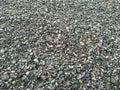 A closeup of a pile of loose rough stones taken at a stone pit. The gravel / grit has been crushed to similar sizes but irregular Royalty Free Stock Photo