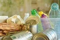 Closeup pile of plastic bottles, wastepaper, tin cans on blurred background Royalty Free Stock Photo