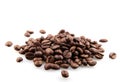 Closeup of a pile of roasted coffee beans isolated on a white background Royalty Free Stock Photo