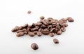 Closeup of a pile of roasted coffee beans isolated on a white background Royalty Free Stock Photo