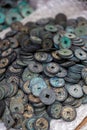 A closeup of a pile of rusty ancient Chinese coins