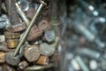 Closeup of a pile of screws and bolts collection kept in a jar