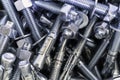 Closeup of Pile of screws and nuts and bolts in a bucket Royalty Free Stock Photo