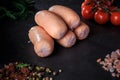 closeup pile of thick short sausages with dill and tomatoes Royalty Free Stock Photo