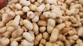 Closeup of pile of unshelled peanuts, organic healthy raw nuts