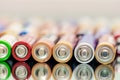 Closeup of pile of used alkaline batteries. Close up colorful rows of selection of AA batteries energy abstract background of Royalty Free Stock Photo