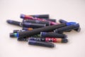 Closeup on a pile of various color ink cartridges for pen Royalty Free Stock Photo