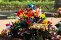 Closeup pile of waste after Loy Krathong festival in Thailand. Colorful flowers decorated on the piece of banana tree with the
