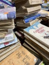 Stacks of worn-out books for sale at a used book fair in Vietnam, May 2022