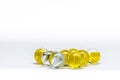 Closeup of a pile of Yellow and white glass marbles isolated on white background Royalty Free Stock Photo