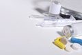 Closeup of pills, syringe, ampules, on the white table.Empty space for prescription Royalty Free Stock Photo