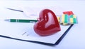 Closeup of a pils, red heart. stethoscope, pen on an rx prescription. Royalty Free Stock Photo