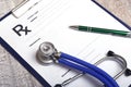 Closeup of a pils, stethoscope, pen on an rx prescription. Royalty Free Stock Photo