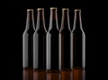 Closeup pin of brown beer bottles. 3D render, studio light, dark mirror background.