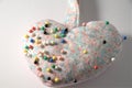Closeup of pin cushion and pins on white Royalty Free Stock Photo