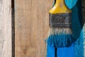 Closeup Of Pine Plank Being Painted In Blue Color Royalty Free Stock Photo