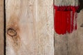 Closeup Of Pine Plank Being Painted In Red Color Royalty Free Stock Photo