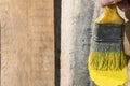 Closeup Of Pine Plank Being Painted In Yellow Color Royalty Free Stock Photo