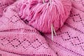 Closeup on pink detail of handmade woven knitting