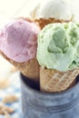 Closeup of pink and green ice cream cones Royalty Free Stock Photo